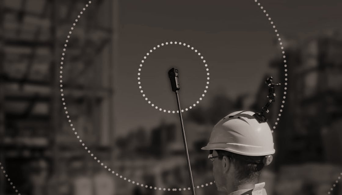 Site worker capturing field conditions with a mounted camera